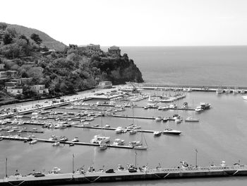 High angle view of boats in sea against clear sky