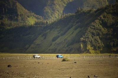 Scenic view of land against mountains