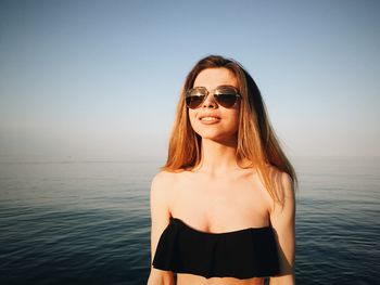 Portrait of young woman in sea