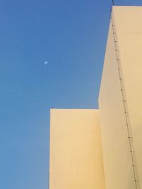 Low angle view of building against clear blue sky