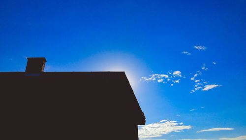 Low angle view of building against blue sky