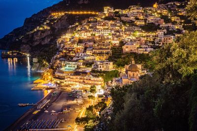High angle view of illuminated houses at positano in amalfi coast