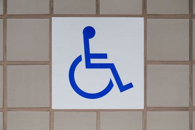 Close-up of sign on wall