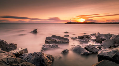 Scenic view of sea against sky during sunset