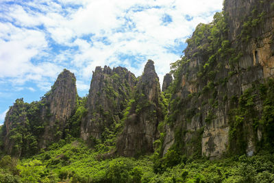 Low angle view of rock formations against sky