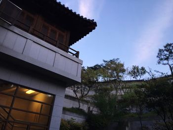 Low angle view of illuminated building against sky
