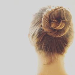 Rear view of woman against white background