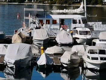 Boats moored at harbor