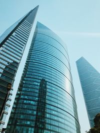 Low angle view of modern buildings against clear sky