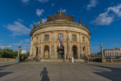 Facade of historic building against sky