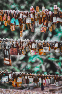 Close-up of padlocks hanging on railing