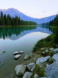 Scenic view of lake and mountains against sky