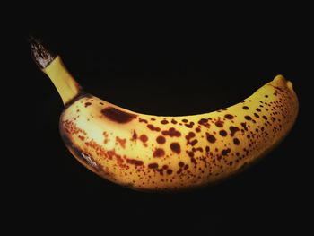 Close-up of fruit over black background