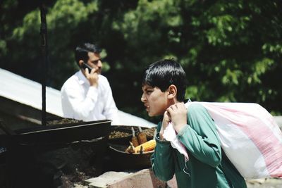 Boy and food on cutting board