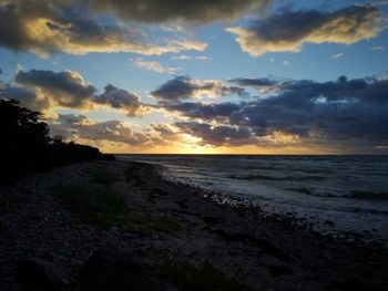 Scenic view of sea against sky at sunset