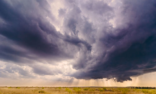 Storm cloud over barren landscape