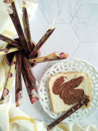 High angle view of bread and chocolate spread on table