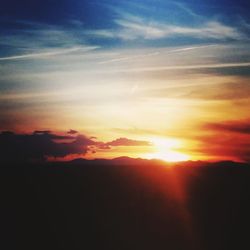 Scenic view of dramatic sky during sunset