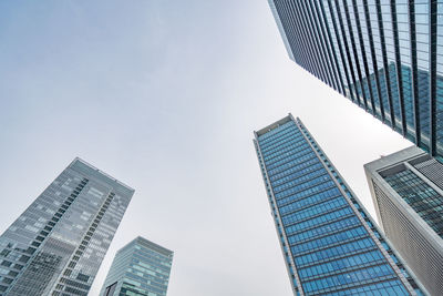 Low angle view of modern buildings against sky