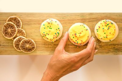 Directly above shot of people holding food on table