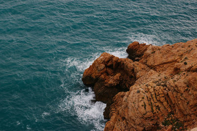 High angle view of rock formation in sea