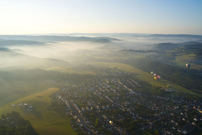 Aerial view of townscape against sky