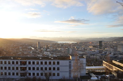 High angle view of cityscape against sky during sunrise 