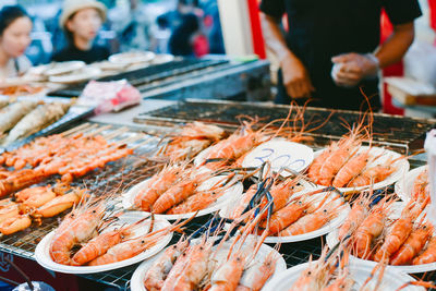 Shrimps in plates for sale at market