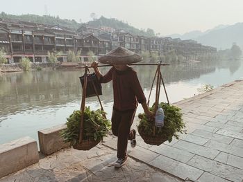 Rear view of woman in lake