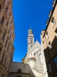 Low angle view of buildings against blue sky