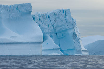 Scenic view of iceberg against sky