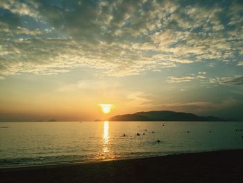Scenic view of sea against sunset sky