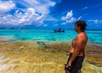 Man looking at sea against sky