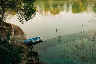 High angle view of boat moored in lake