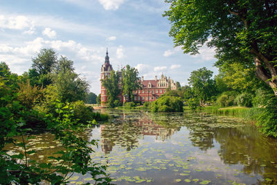 Scenic view of lake against sky and castle 
