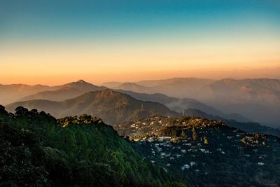 Scenic view of mountains against sky during sunset