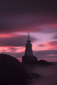 Silhouette of building against sky during sunset