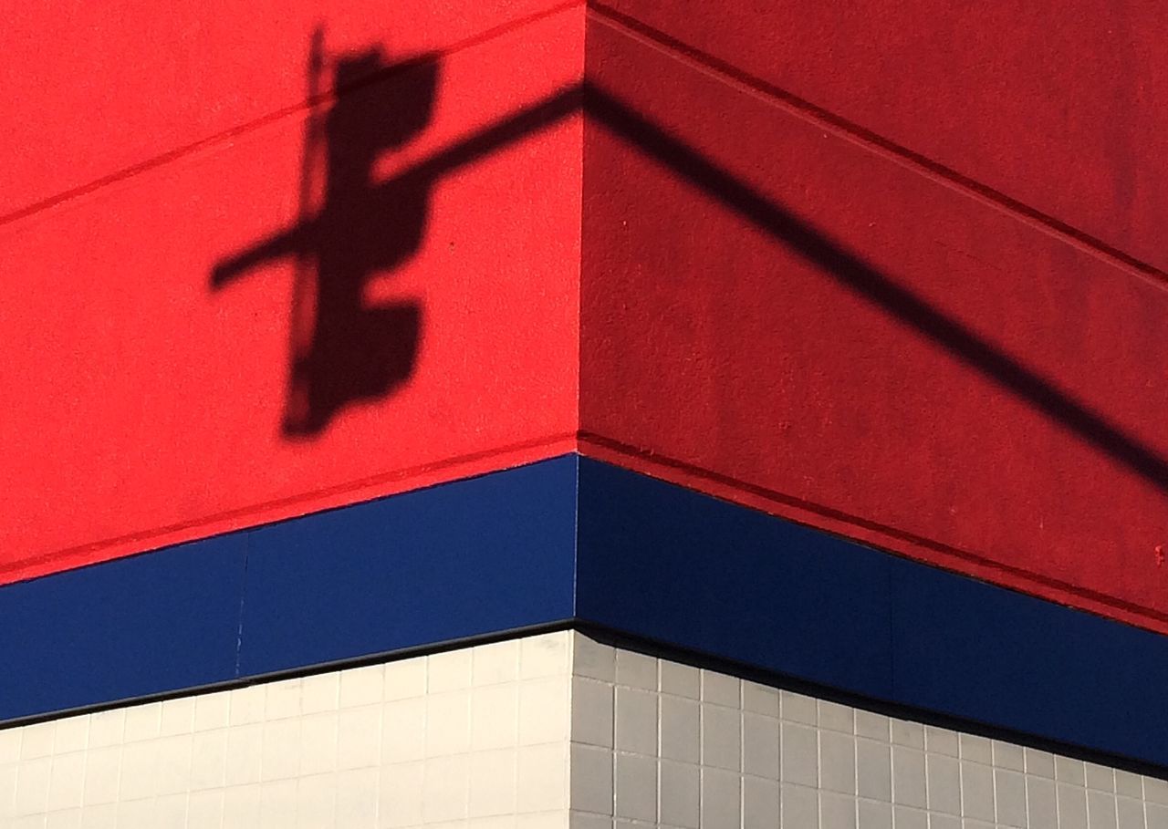 architecture, red, building exterior, built structure, low angle view, wall - building feature, full frame, backgrounds, pattern, brick wall, building, window, wall, no people, outdoors, day, city, shadow, modern, multi colored