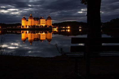 Reflection of building in river at night