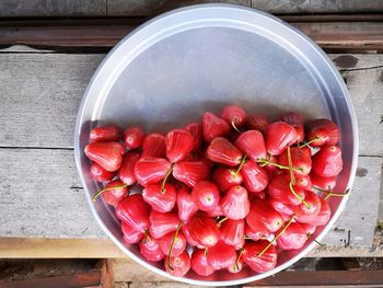 High angle view of strawberries in bowl on table