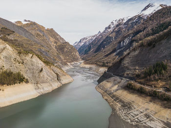 Panoramic drone shot of low water on lac chambon in french alps