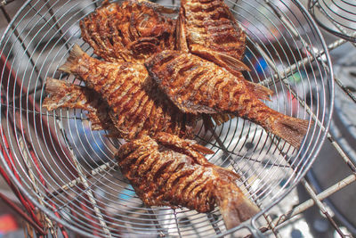 High angle view of meat on barbecue grill