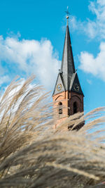 Low angle view of bell tower against sky