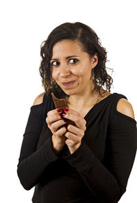 Portrait of smiling young woman against white background