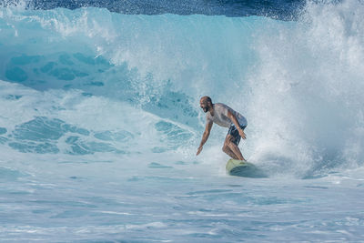 Man surfing in sea