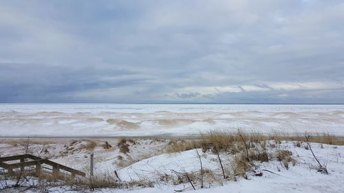 Scenic view of beach against sky