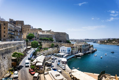 High angle view of buildings against sea