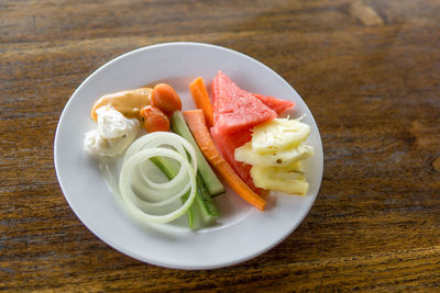 Close-up of fruit salad in plate on table