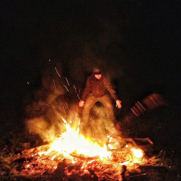 burning, fire - natural phenomenon, flame, heat - temperature, night, bonfire, glowing, campfire, fire, illuminated, firewood, heat, motion, dark, danger, indoors, smoke - physical structure, light - natural phenomenon, orange color, high angle view