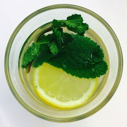 Close-up of mint tea on white background